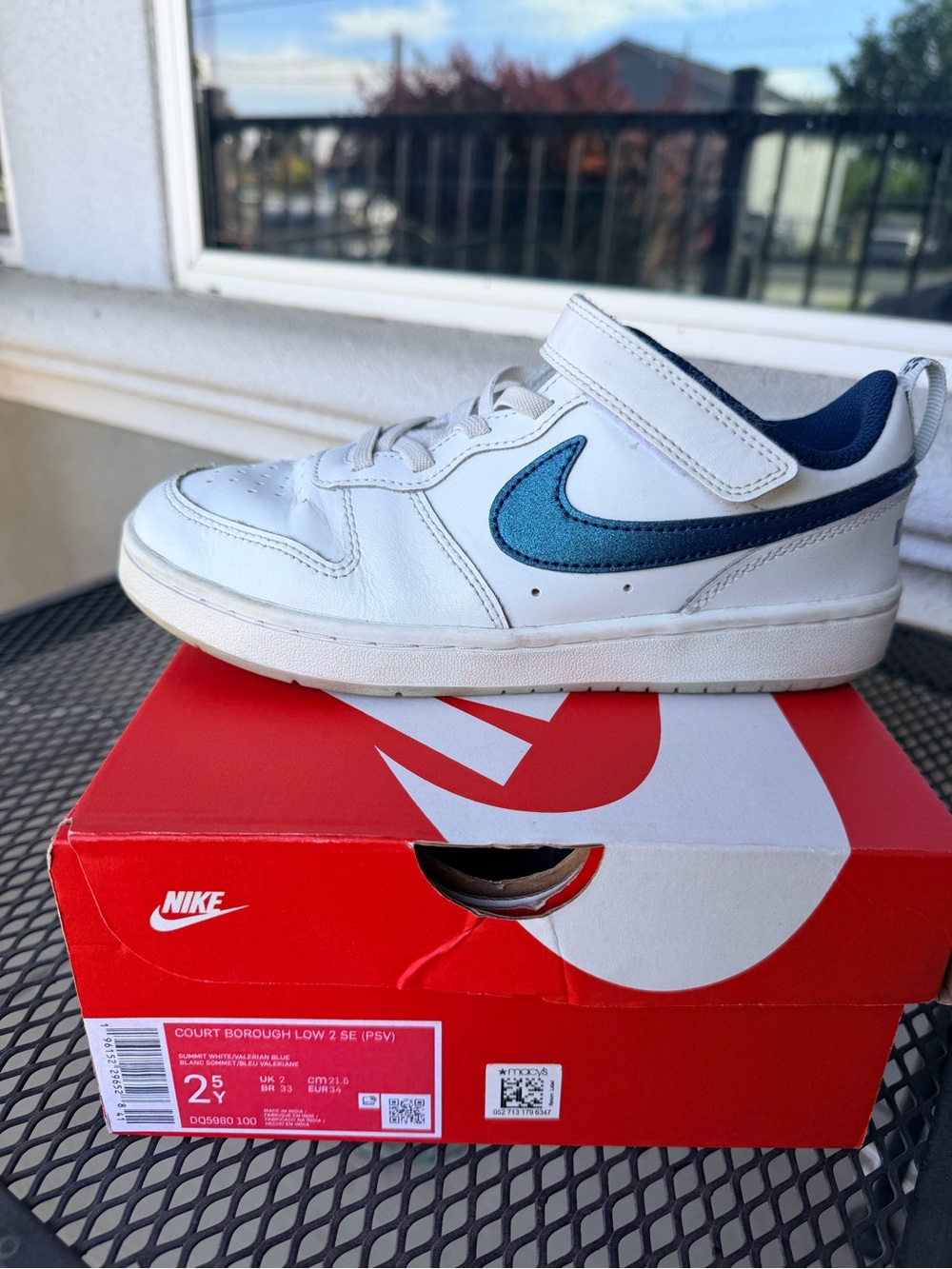 Nike Kids White Sneaker with Blue Swoosh